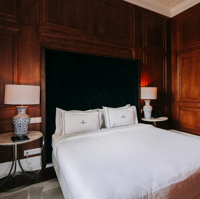 Dona Amelia bedroom, navy walls and wood panelling